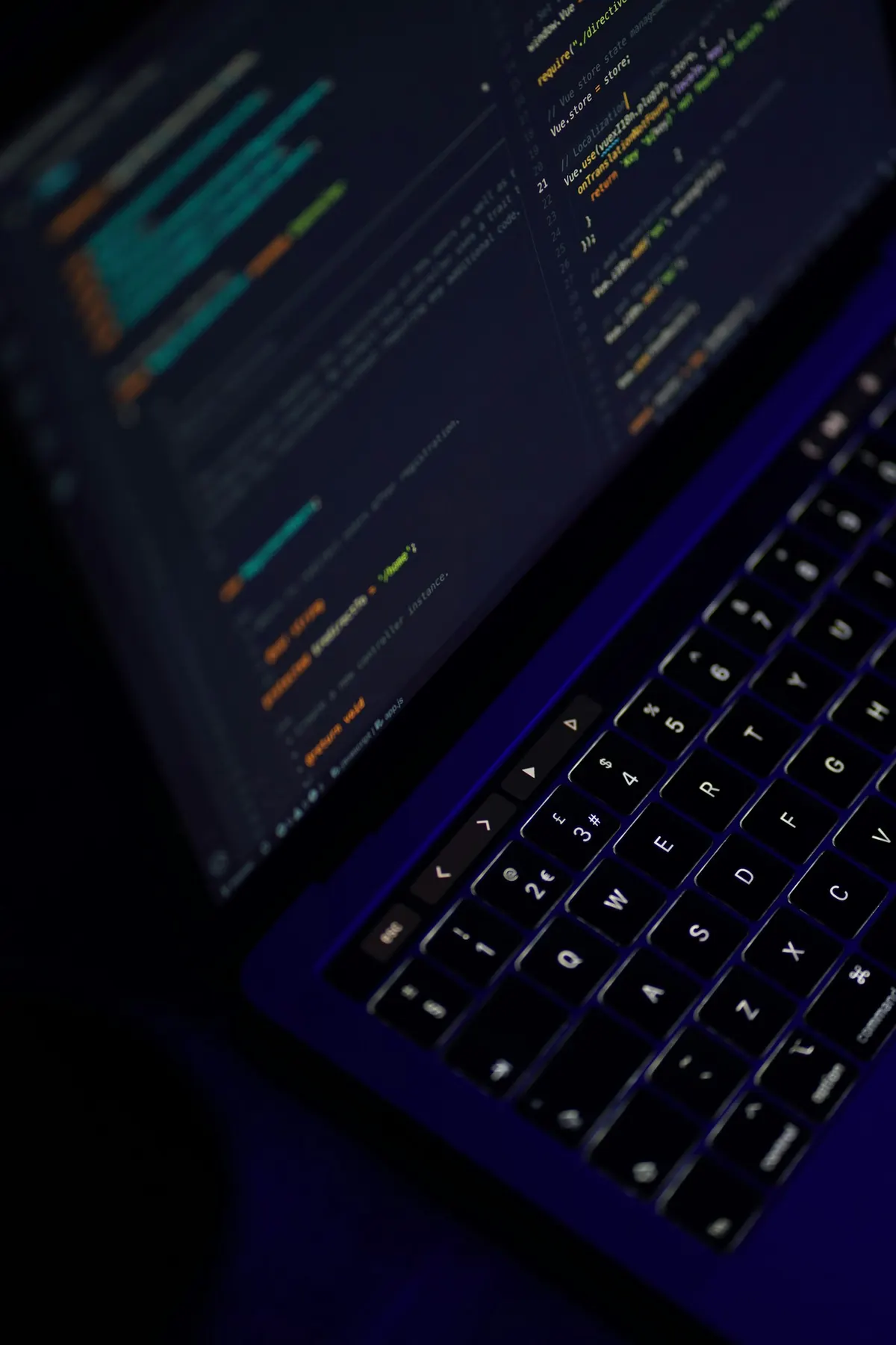 Source code displayed on a laptop screen